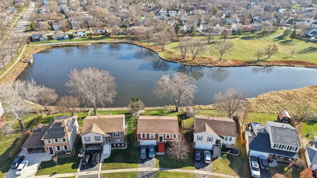 an aerial view of a house with a swimming pool