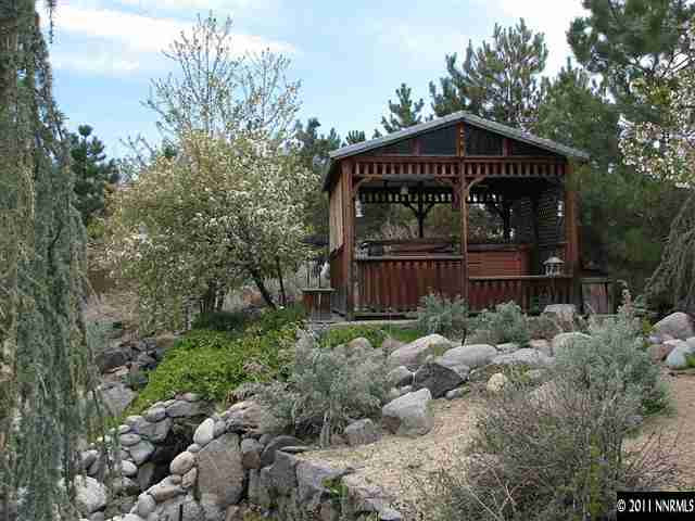 105 Gazelle Road Reno, NV 89511 - Photo 3 of 13 a front view of a house with garden