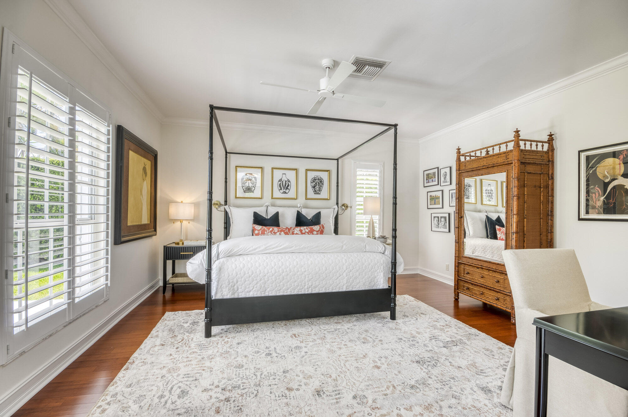 10182 Southeast Acorn Way Jupiter, FL 33469 - Photo 15 of 38 a bedroom with a large bed and a chandelier