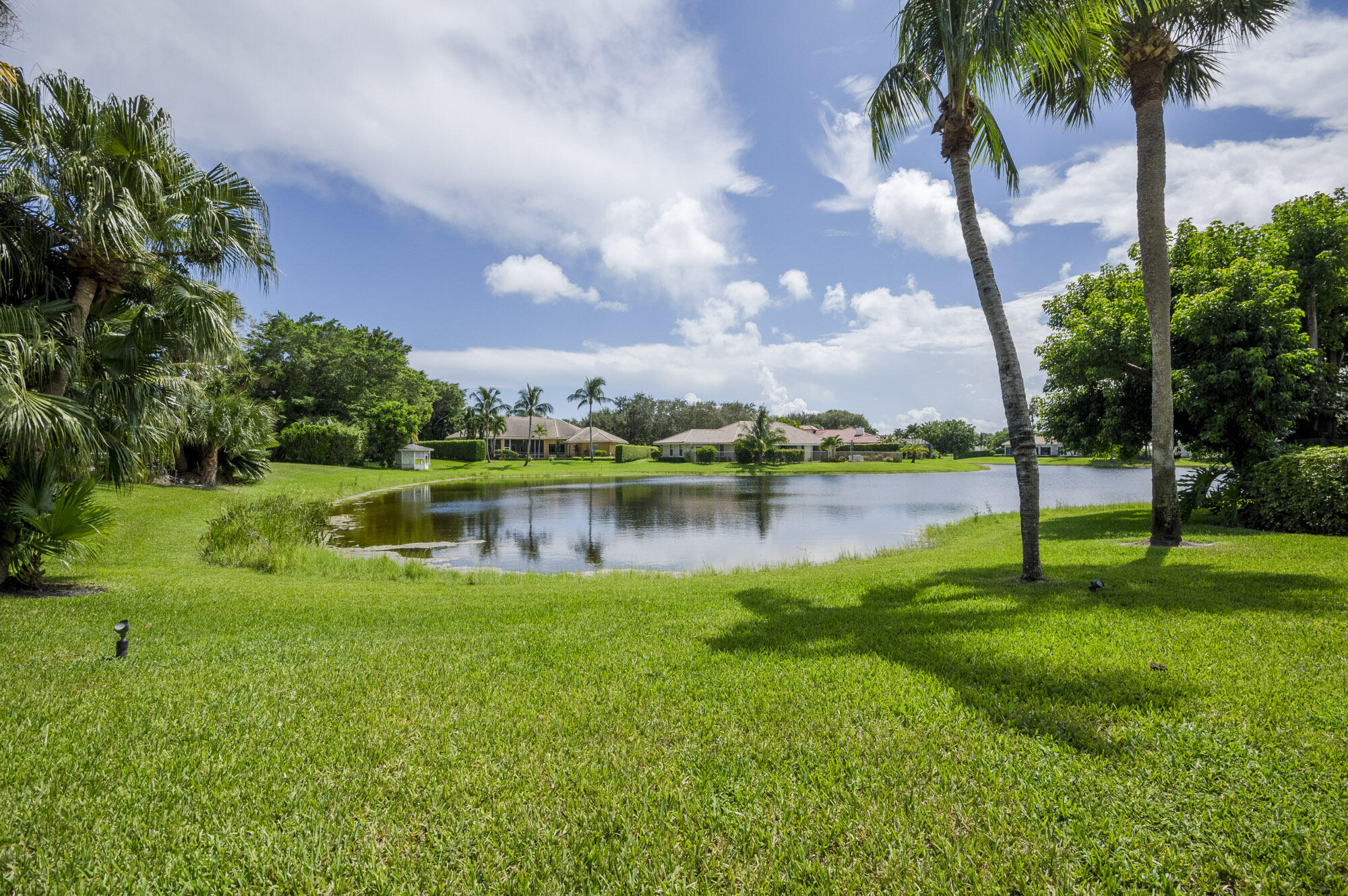 10182 Southeast Acorn Way Jupiter, FL 33469 - Photo 35 of 38 a view of a lake with a big yard