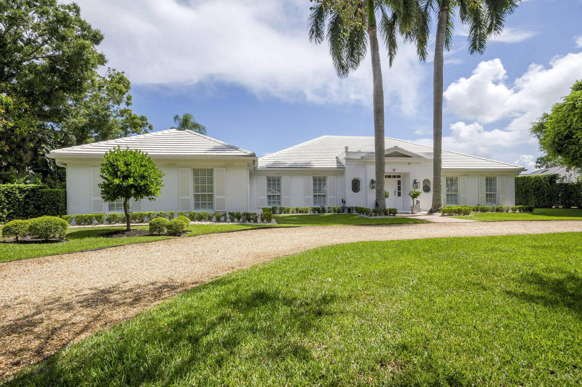 10182 Southeast Acorn Way Jupiter, FL 33469 - Photo 38 of 38 a front view of house with yard and green space