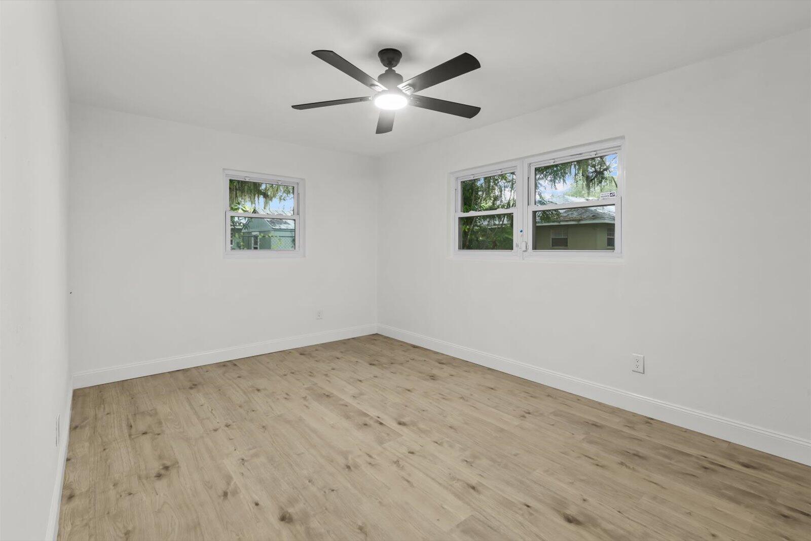 603 Southwest 14th Street Okeechobee, FL 34974 - Photo 24 of 41 an empty room with window and ceiling fan