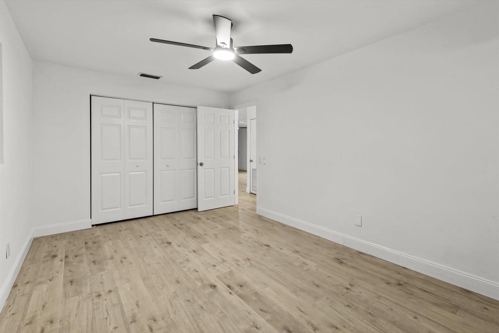 603 Southwest 14th Street Okeechobee, FL 34974 - Photo 25 of 41 wooden floor in an empty room
