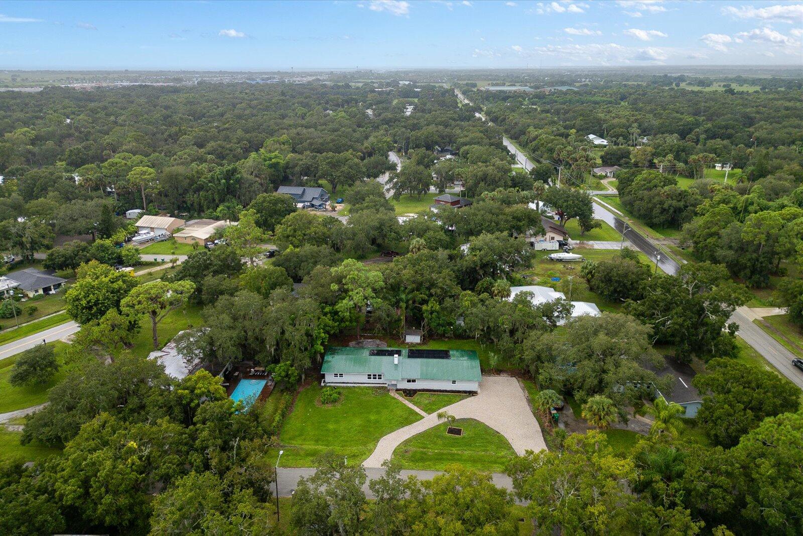 603 Southwest 14th Street Okeechobee, FL 34974 - Photo 40 of 41 an aerial view of residential houses with outdoor space and trees