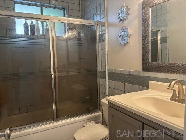 944 Maya Street Spring Valley, CA 91977 - Photo 17 of 20 a bathroom with a sink toilet and shower