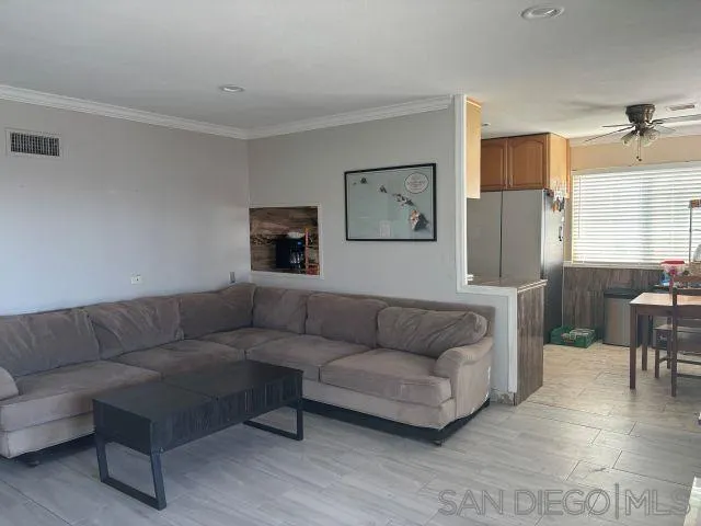 944 Maya Street Spring Valley, CA 91977 - Photo 3 of 20 a living room with furniture and a couch