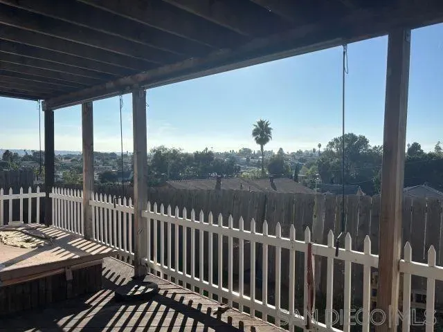 a view of balcony with furniture