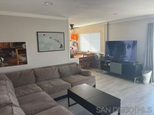 944 Maya Street Spring Valley, CA 91977 - Photo 6 of 20 a living room with furniture and a flat screen tv