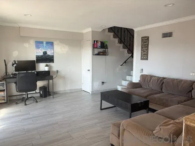 a kitchen with stainless steel appliances granite countertop a refrigerator and a stove