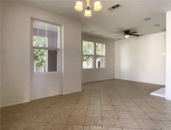 an empty room that has a window in it