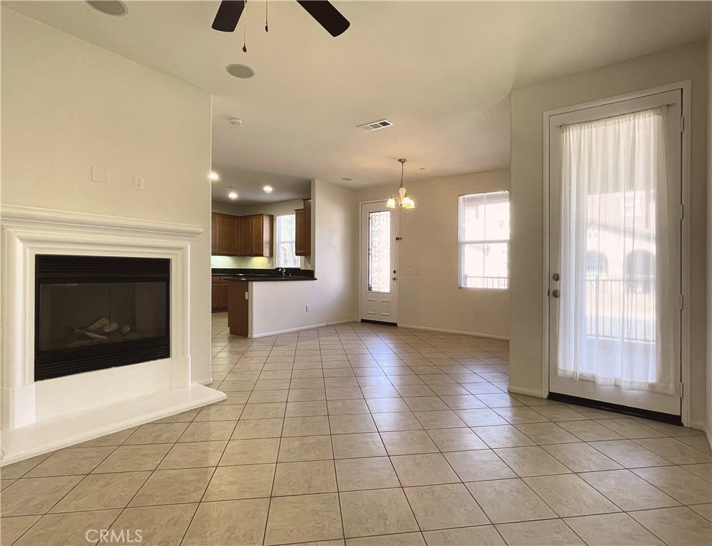 1488 Springfield Way Upland, CA 91786 - Photo 4 of 16 a view of an empty room with a fireplace and a window