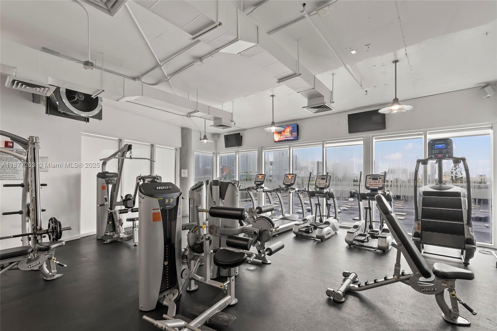 10 Southwest South River Drive, Unit 1006 Miami, FL 33130 - Photo 14 of 16 a view of a room with gym equipment