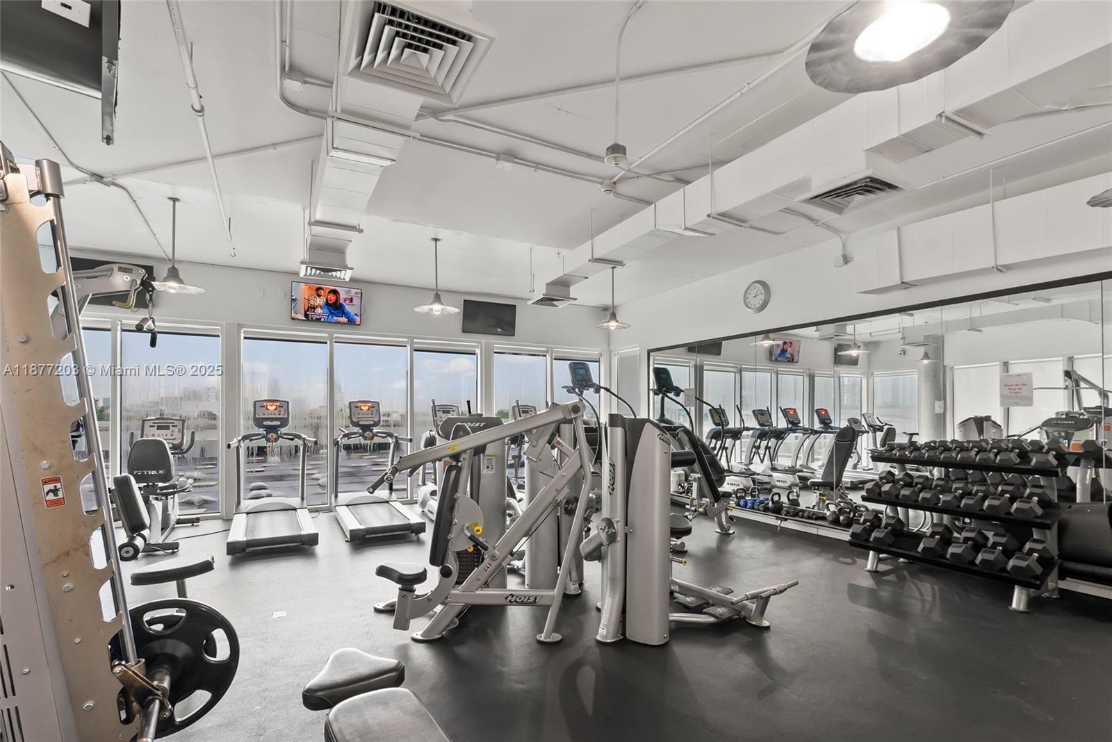 10 Southwest South River Drive, Unit 1006 Miami, FL 33130 - Photo 15 of 16 a view of a room with gym equipment