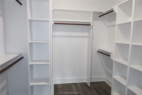 a bathroom with a bathtub a sink and a mirror