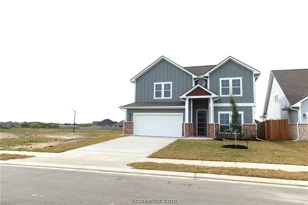 a view of houses with yard