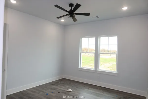 a view of cabinets and wooden floor