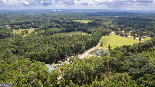 a view of house with outdoor space and swimming pool
