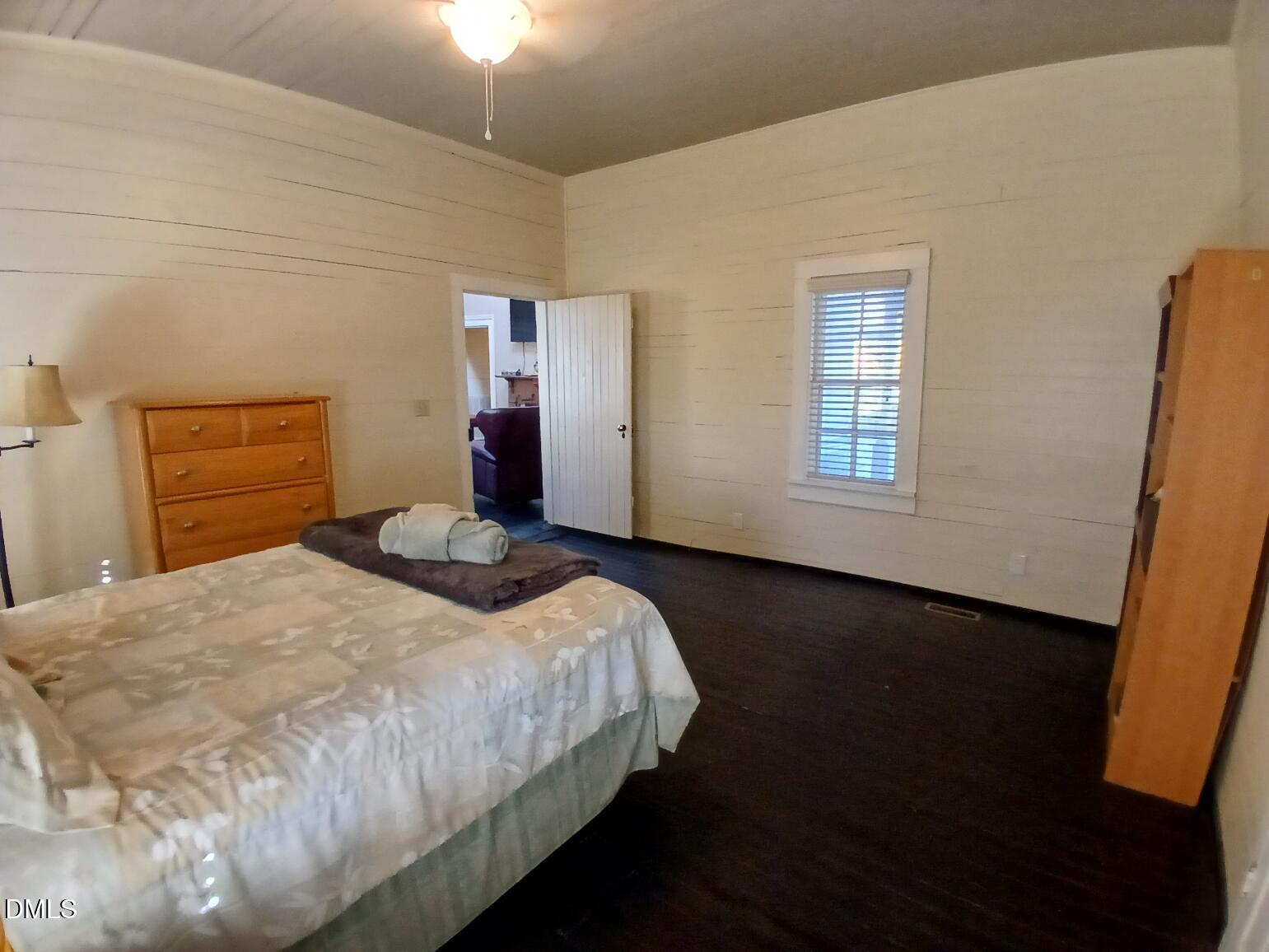 1920 Kelly Road Apex, NC 27502 - Photo 27 of 44 a bedroom with a bed and wooden floor