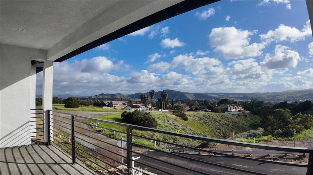 3704 Howe Street Corona, CA 92881 - Photo 23 of 26 a view of a balcony with wooden floor