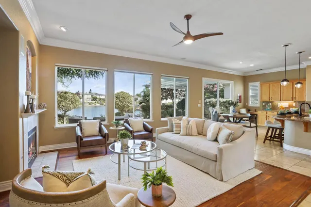 a kitchen with sink a stove and chairs