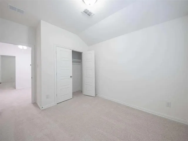 a view of empty room with windows