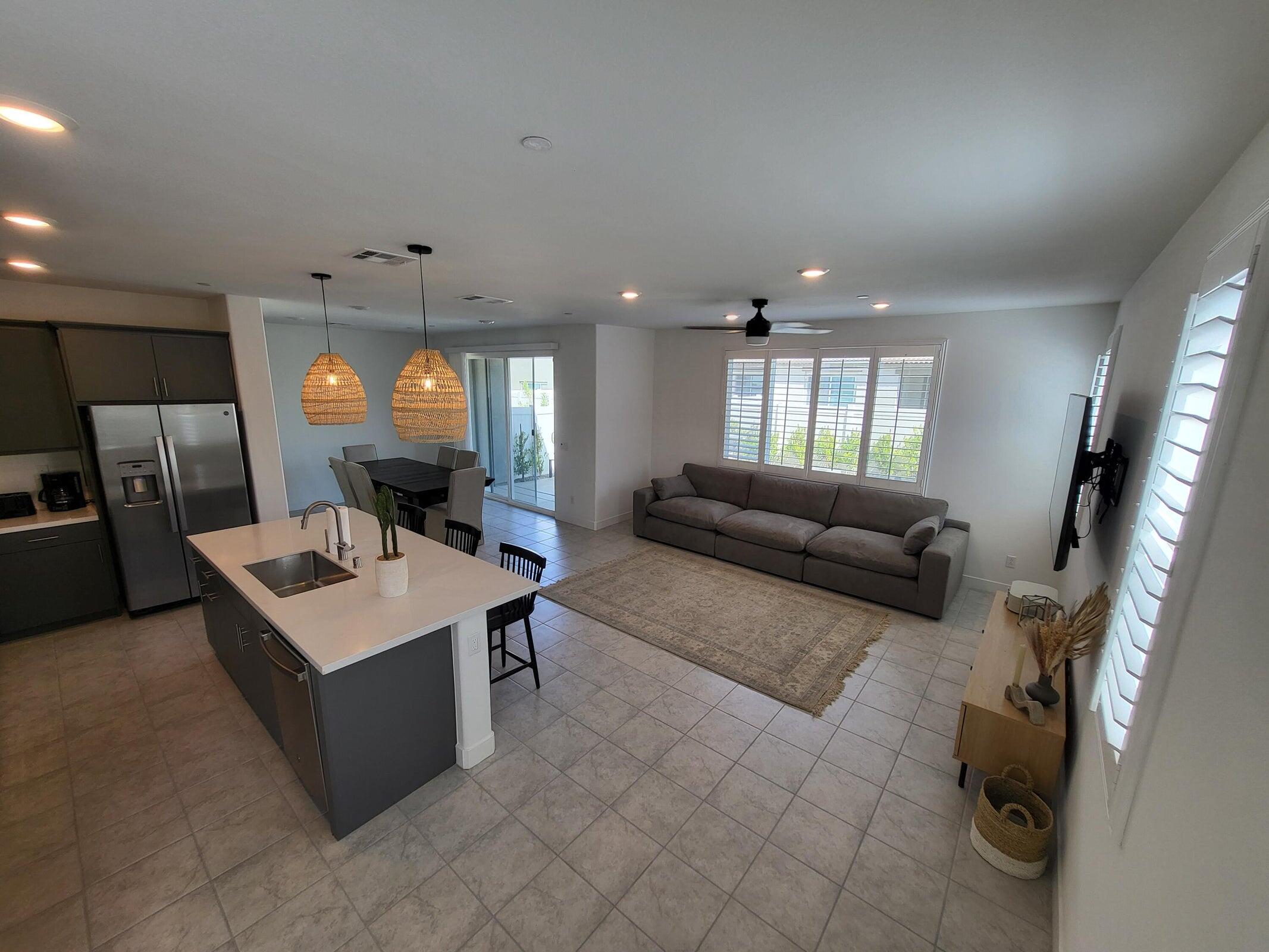 76273 Cornell Way Palm Desert, CA 92211 - Photo 4 of 16 a living room with furniture and a table