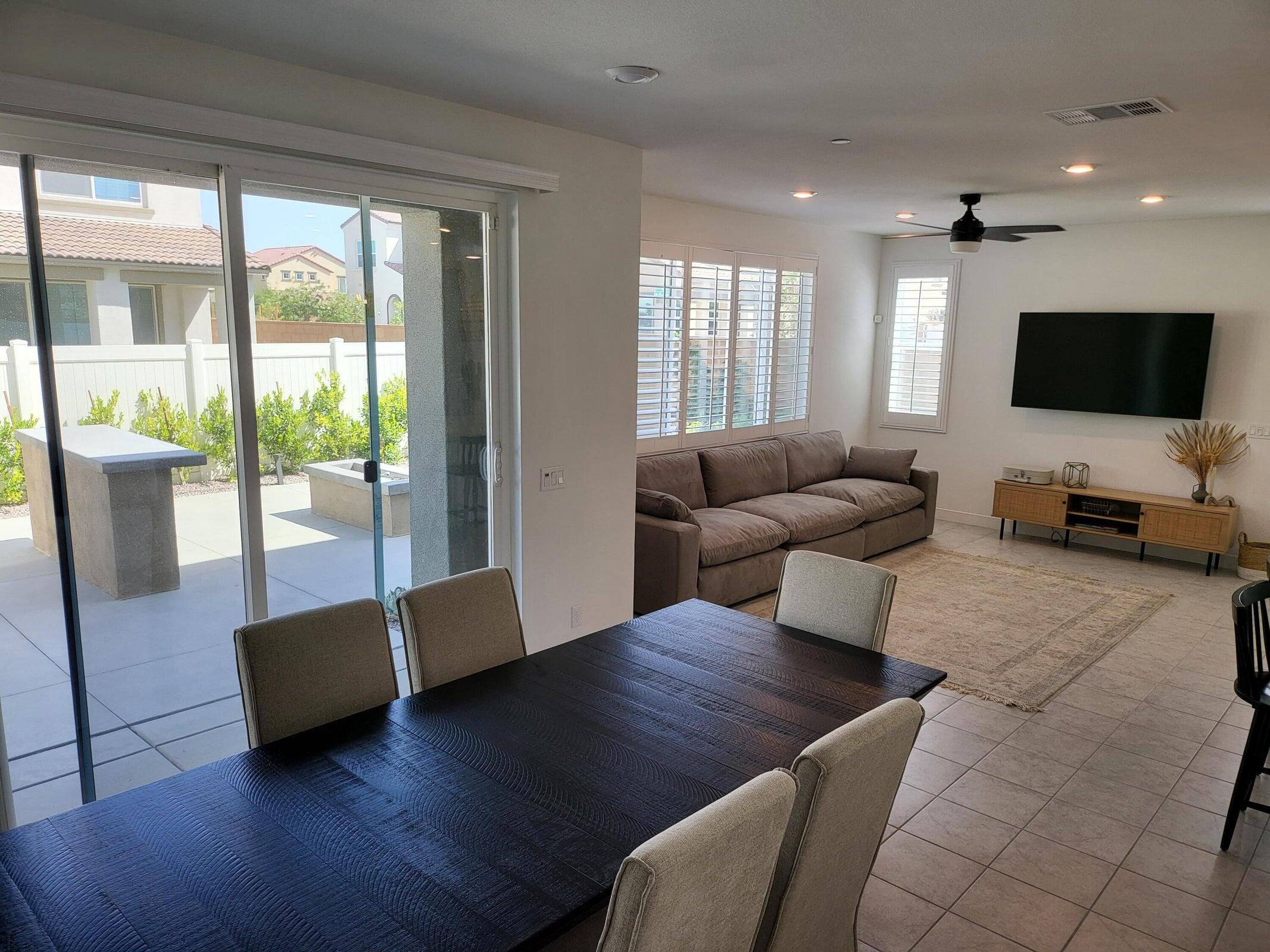 76273 Cornell Way Palm Desert, CA 92211 - Photo 6 of 16 a living room with furniture and a flat screen tv
