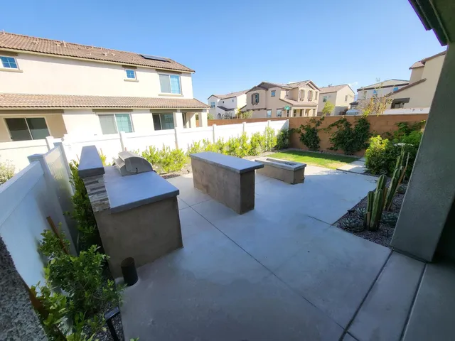a view of a patio with couches and potted plants