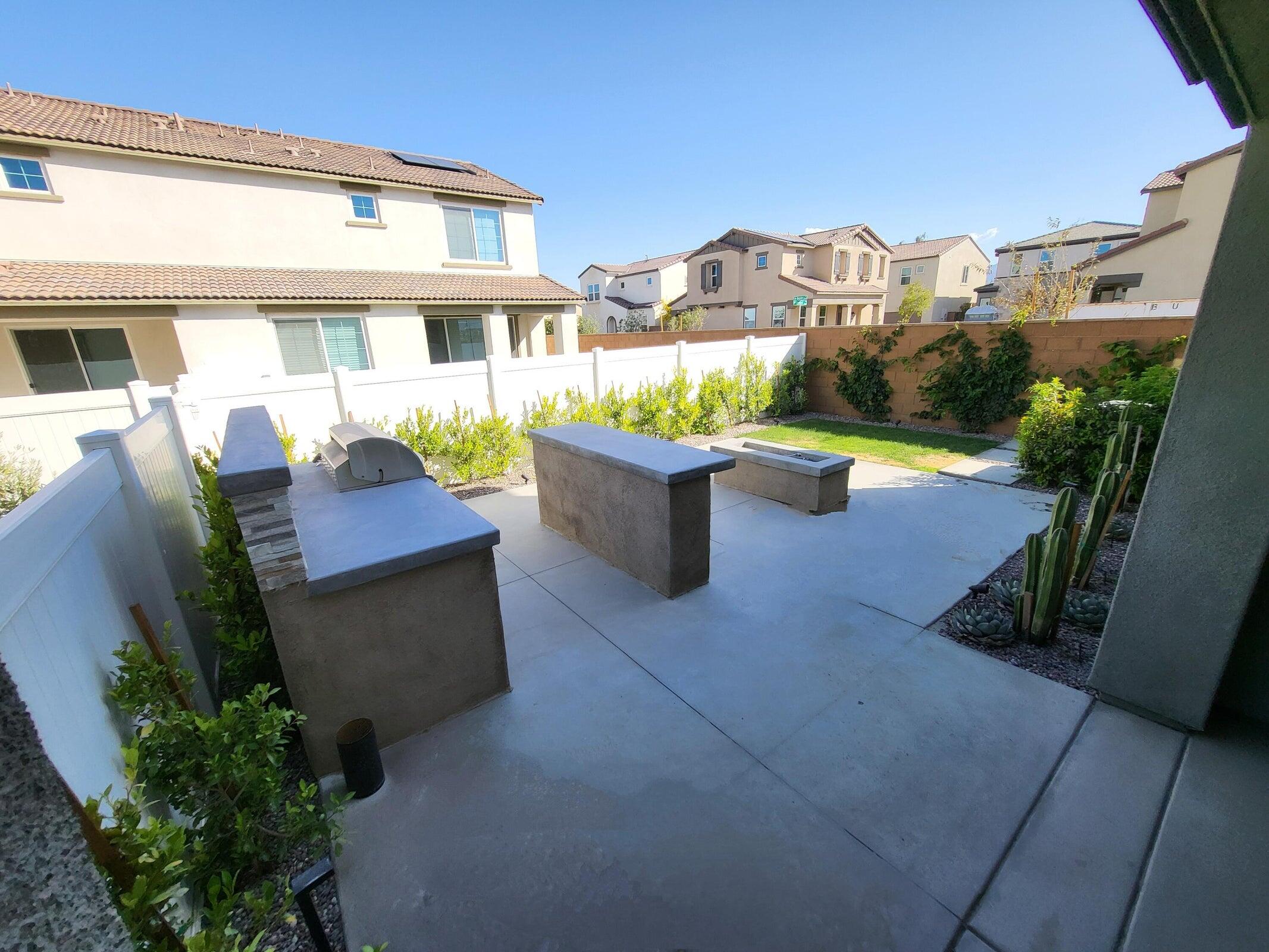 76273 Cornell Way Palm Desert, CA 92211 - Photo 7 of 16 a view of a patio with couches and potted plants