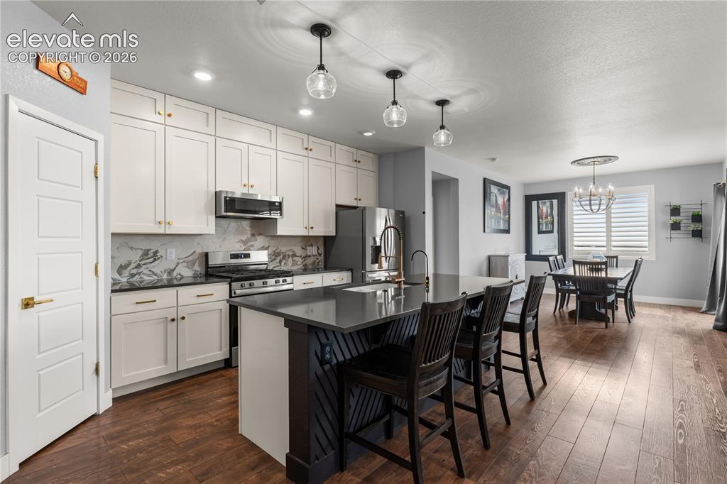 12781 Granite Ridge Drive Peyton, CO 80831 - Photo 8 of 41 Gas fireplace is the heart of the home.