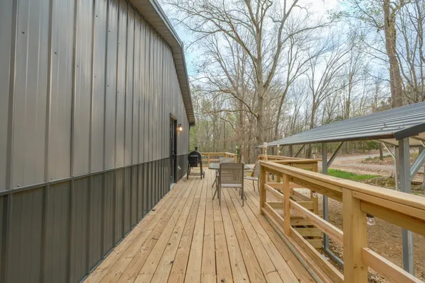 a view of balcony with wooden floor and outdoor space