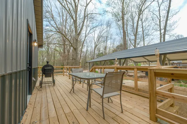 a view of a chairs and table on the balcony