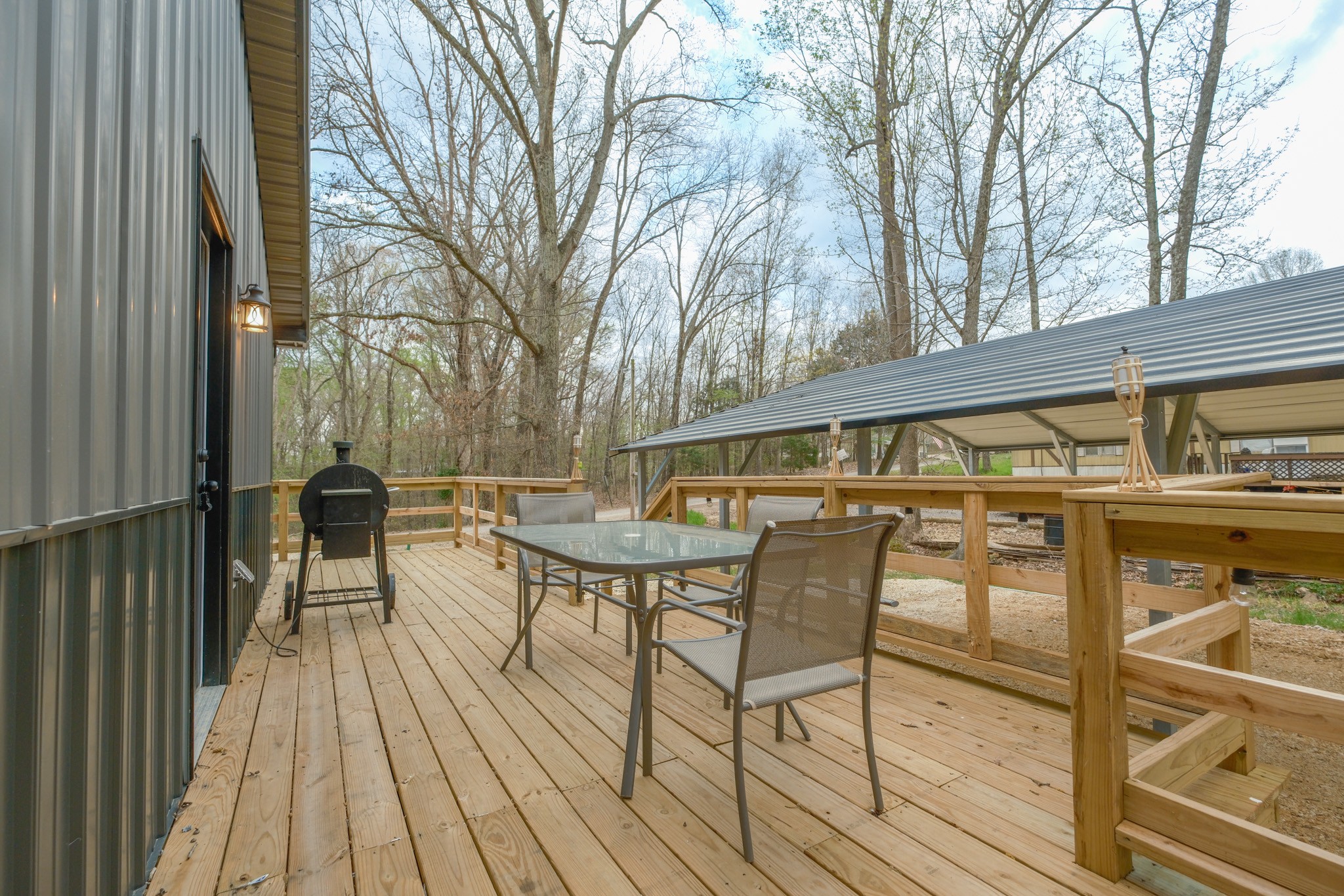 55 Sumerfield Drive Springville, TN 38256 - Photo 12 of 32 a view of a chairs and table on the balcony