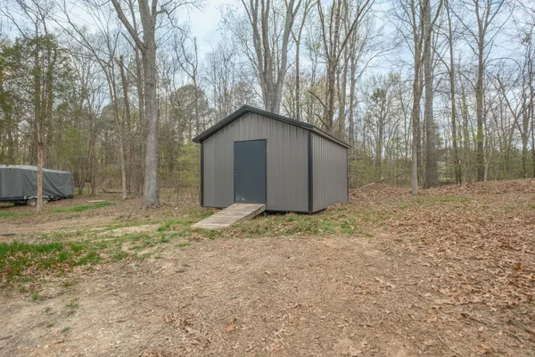 a house with trees in the background