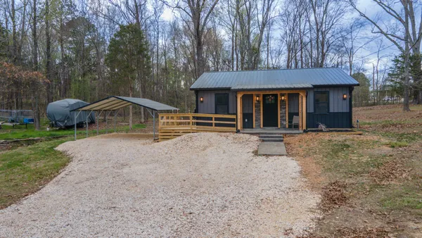 a house with trees in the background