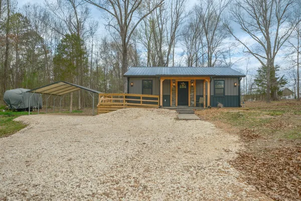 a house with trees in the background