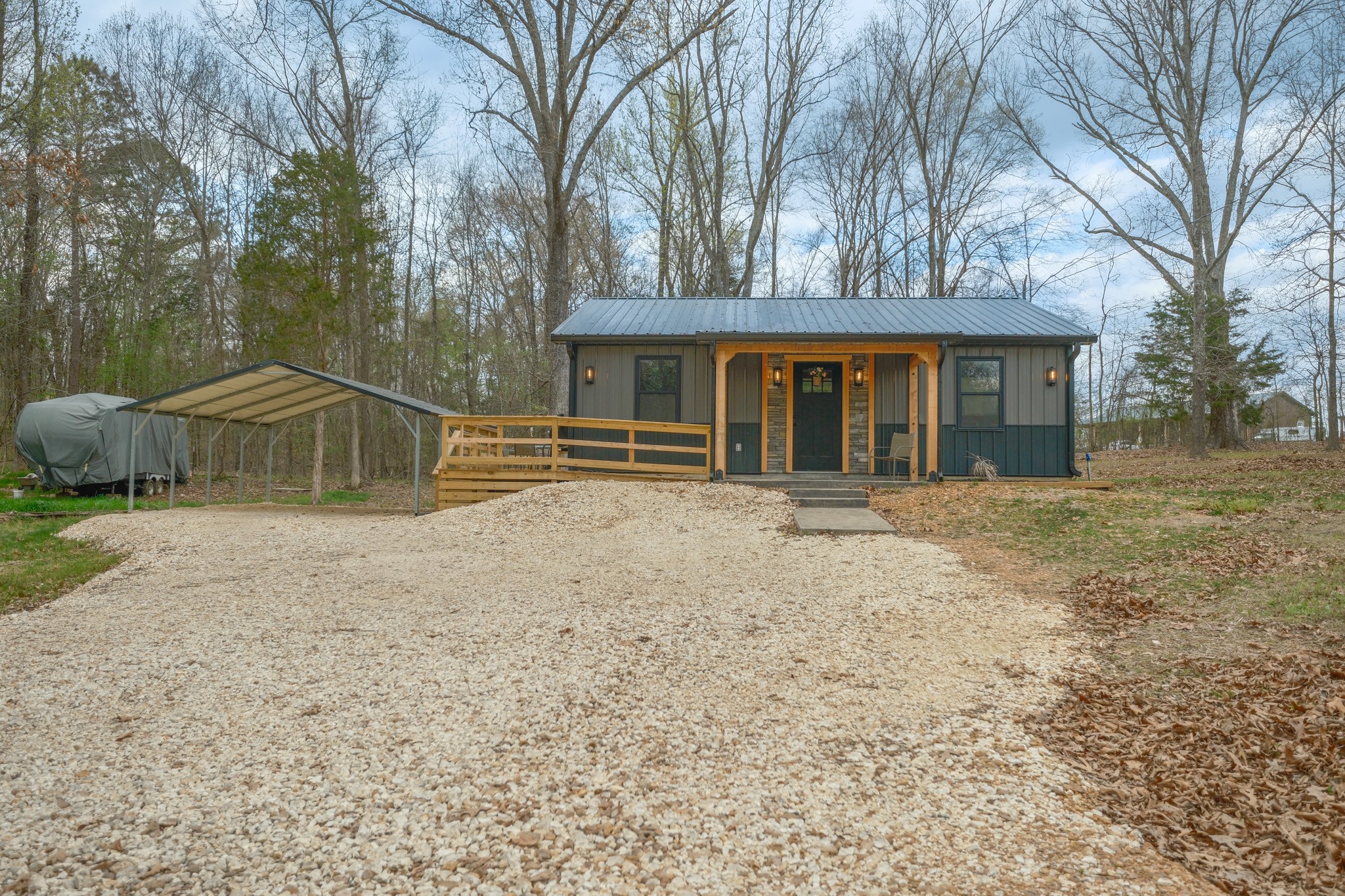 55 Sumerfield Drive Springville, TN 38256 - Photo 8 of 32 a house with trees in the background