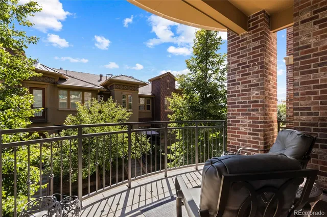 a view of a balcony with chairs