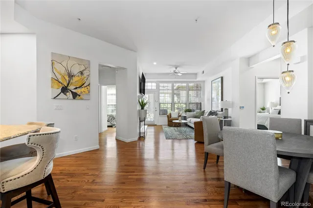 a view of a dining room with furniture window and wooden floor
