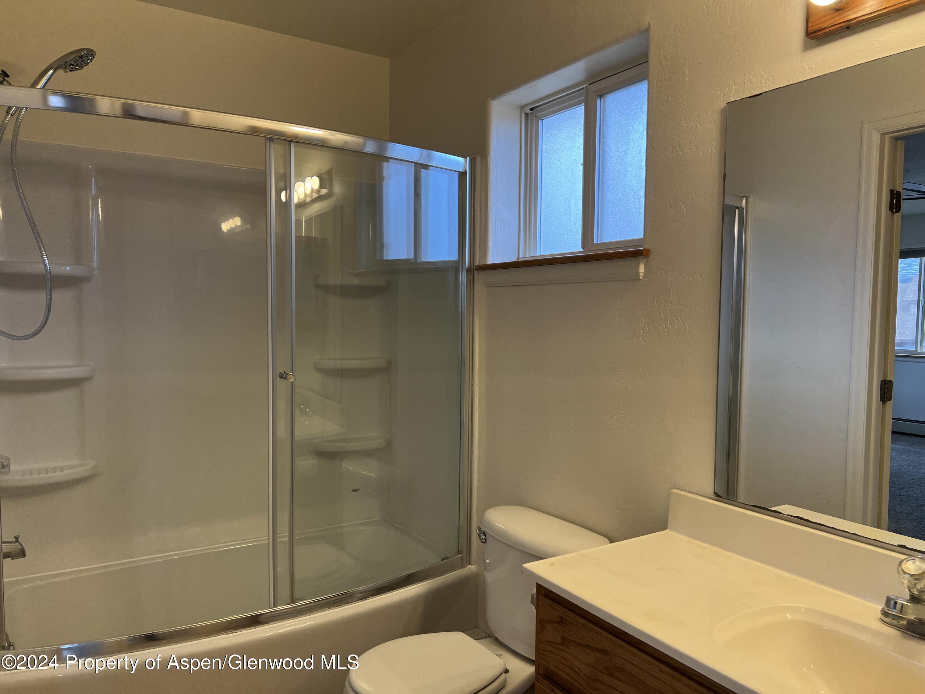 765 Fir Avenue Rifle, CO 81650 - Photo 13 of 34 a bathroom with a sink toilet and shower