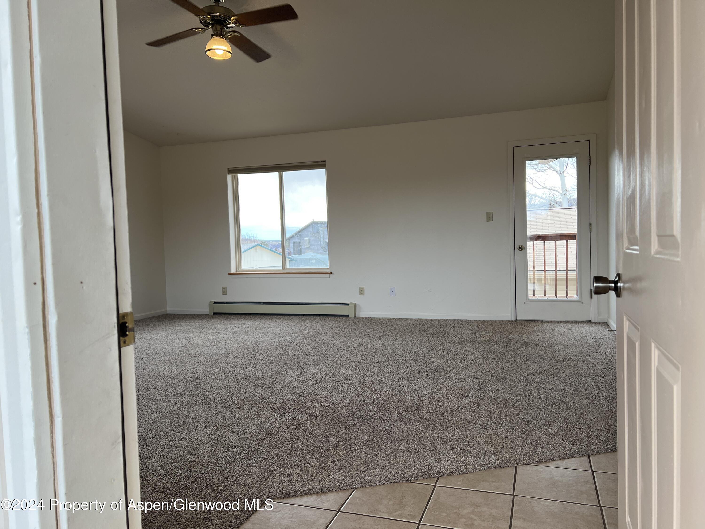 765 Fir Avenue Rifle, CO 81650 - Photo 4 of 34 an empty room with windows