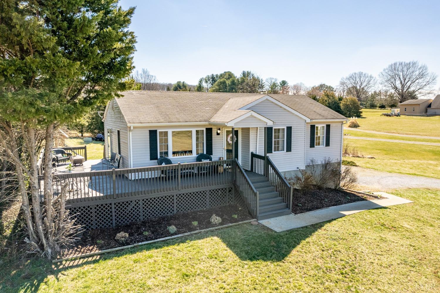 1077 Terrace View Road Goode, VA 24556 - Photo 1 of 54 a view of a house with swimming pool and sitting area