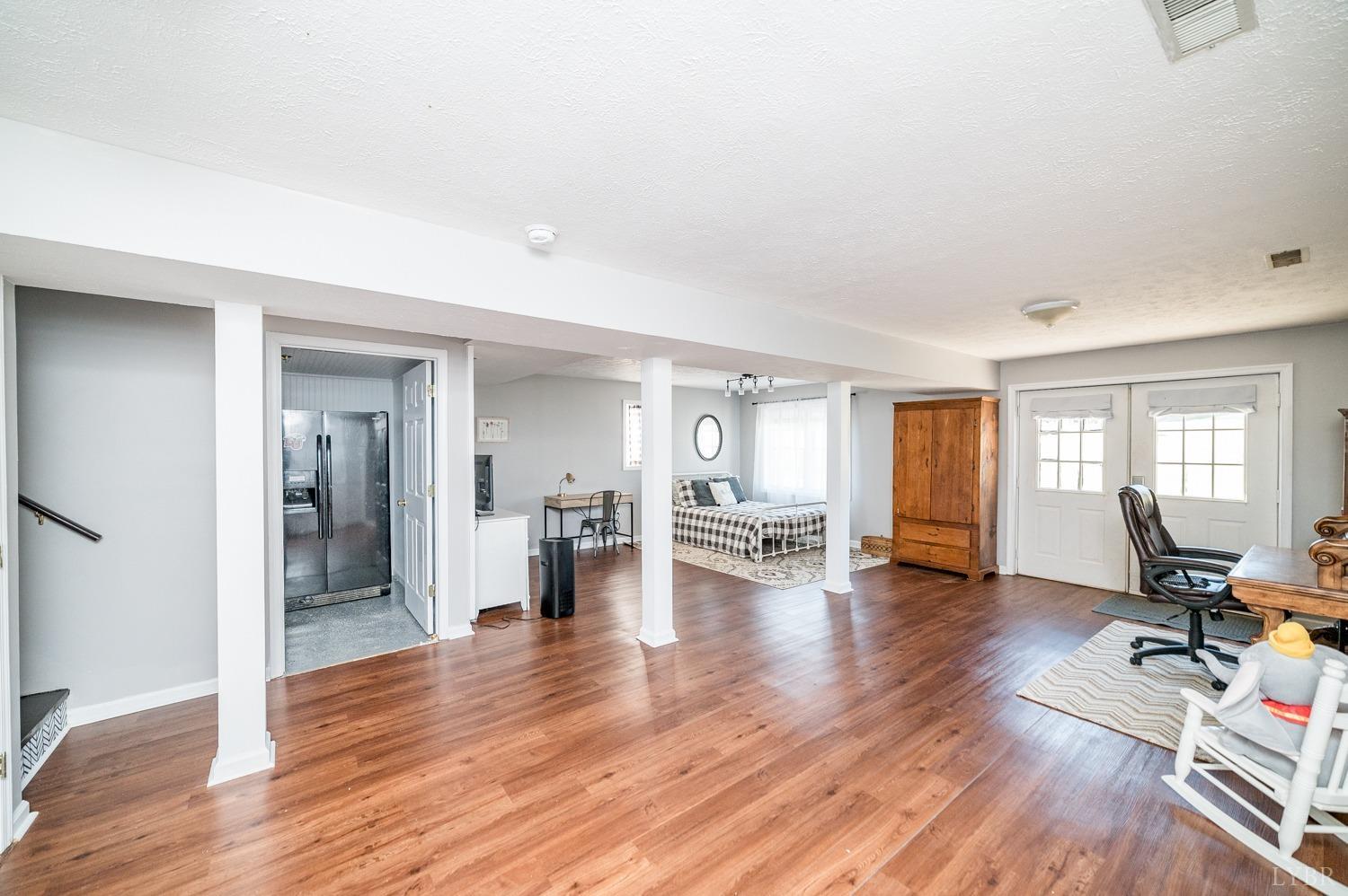 1077 Terrace View Road Goode, VA 24556 - Photo 19 of 54 a view of a room with wooden floor and furniture