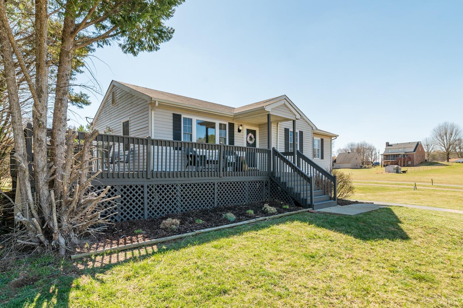 1077 Terrace View Road Goode, VA 24556 - Photo 34 of 54 a front view of a house with a yard