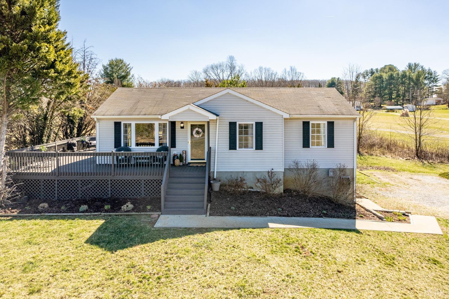 1077 Terrace View Road Goode, VA 24556 - Photo 44 of 54 a front view of a house with a yard
