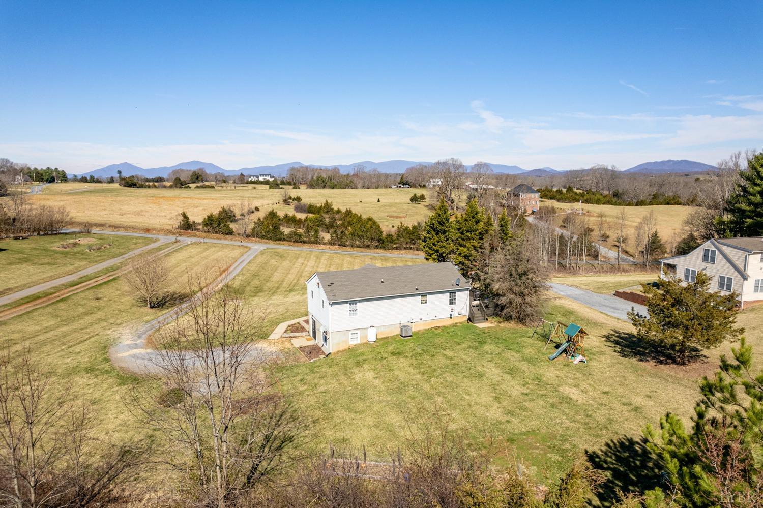 1077 Terrace View Road Goode, VA 24556 - Photo 49 of 54 a view of a lake with houses in the back