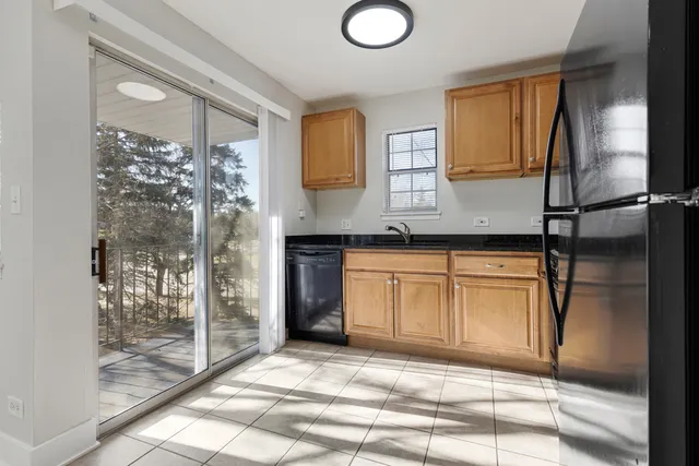 a spacious bathroom with a granite countertop sink and a mirror