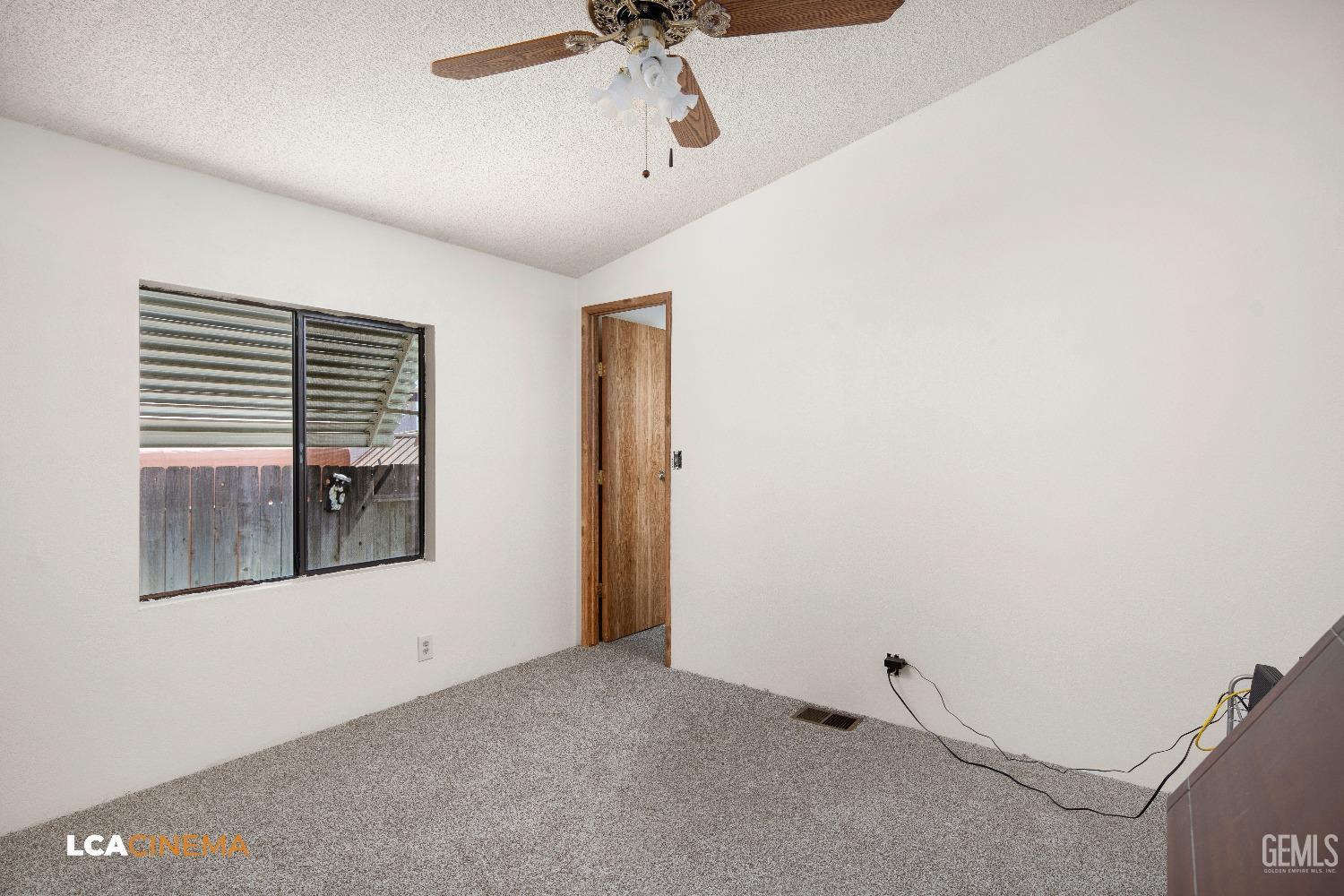 Undisclosed Address Bakersfield, CA 93307 - Photo 12 of 20 a view of a livingroom with an empty space