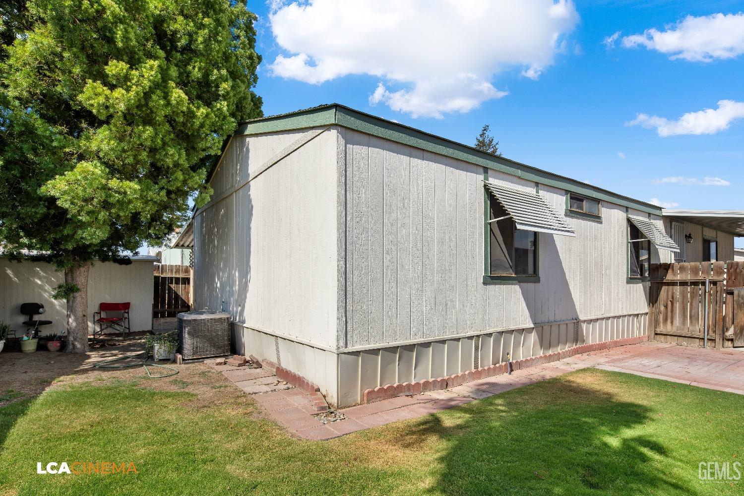 Undisclosed Address Bakersfield, CA 93307 - Photo 17 of 20 a backyard of a house with table and chairs