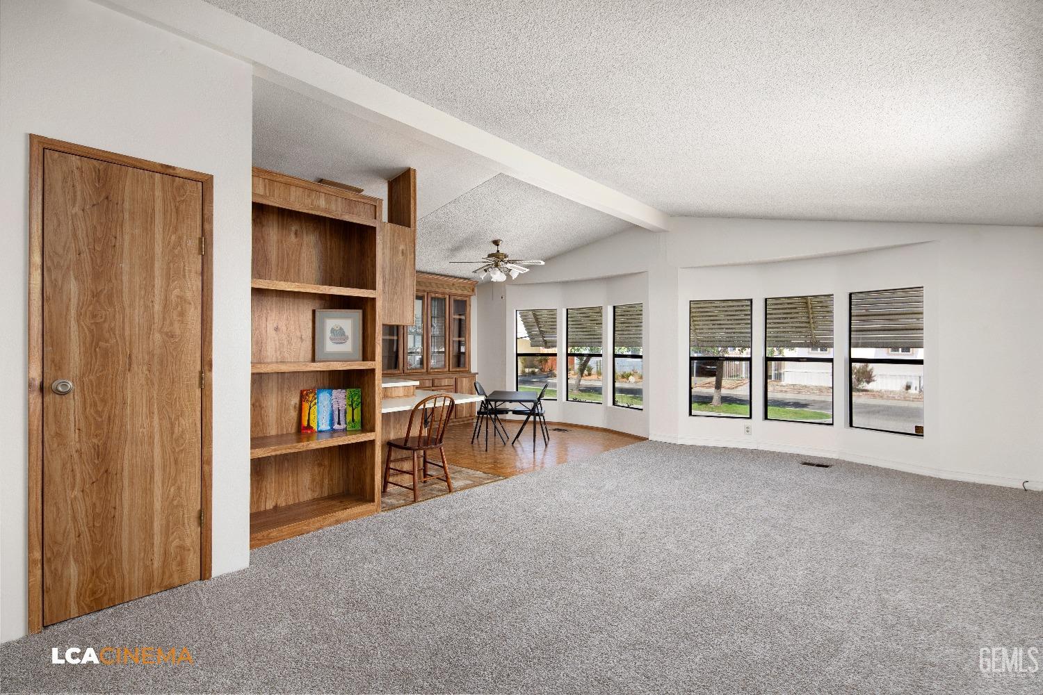 Undisclosed Address Bakersfield, CA 93307 - Photo 4 of 20 a view of workspace with furniture and cabinet